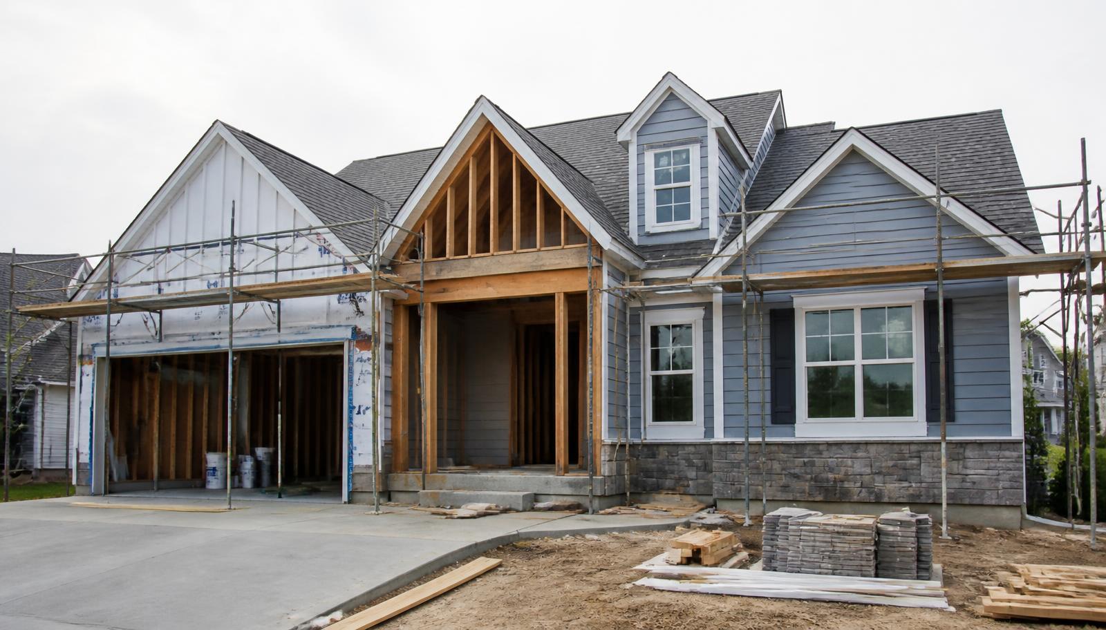 Home under renovation with framing and scaffolding